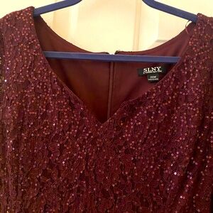 sequined rich burgundy dress; 3/4 length sheer lace sleeves; tea length